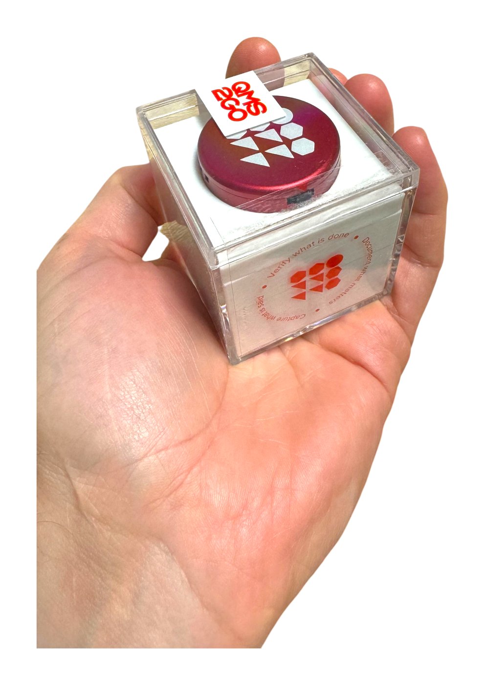 QMS2GO branded voice recorder retail packaging held in hand
