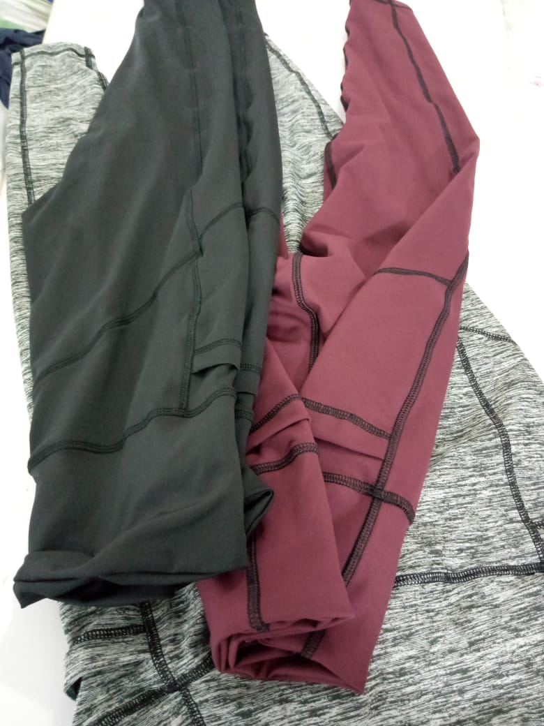 Stack of early Kool Pressions fabric prototypes in black, maroon and grey heather