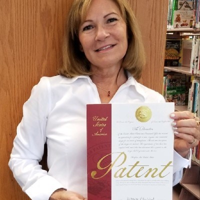 Mary Allen, CEO of Zippy, holding her US patent