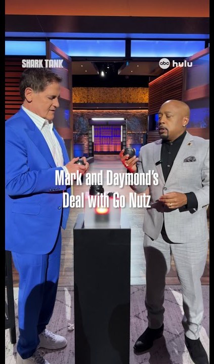 Mark Cuban and Daymond John inspecting the GoNutz groomer before making their deal