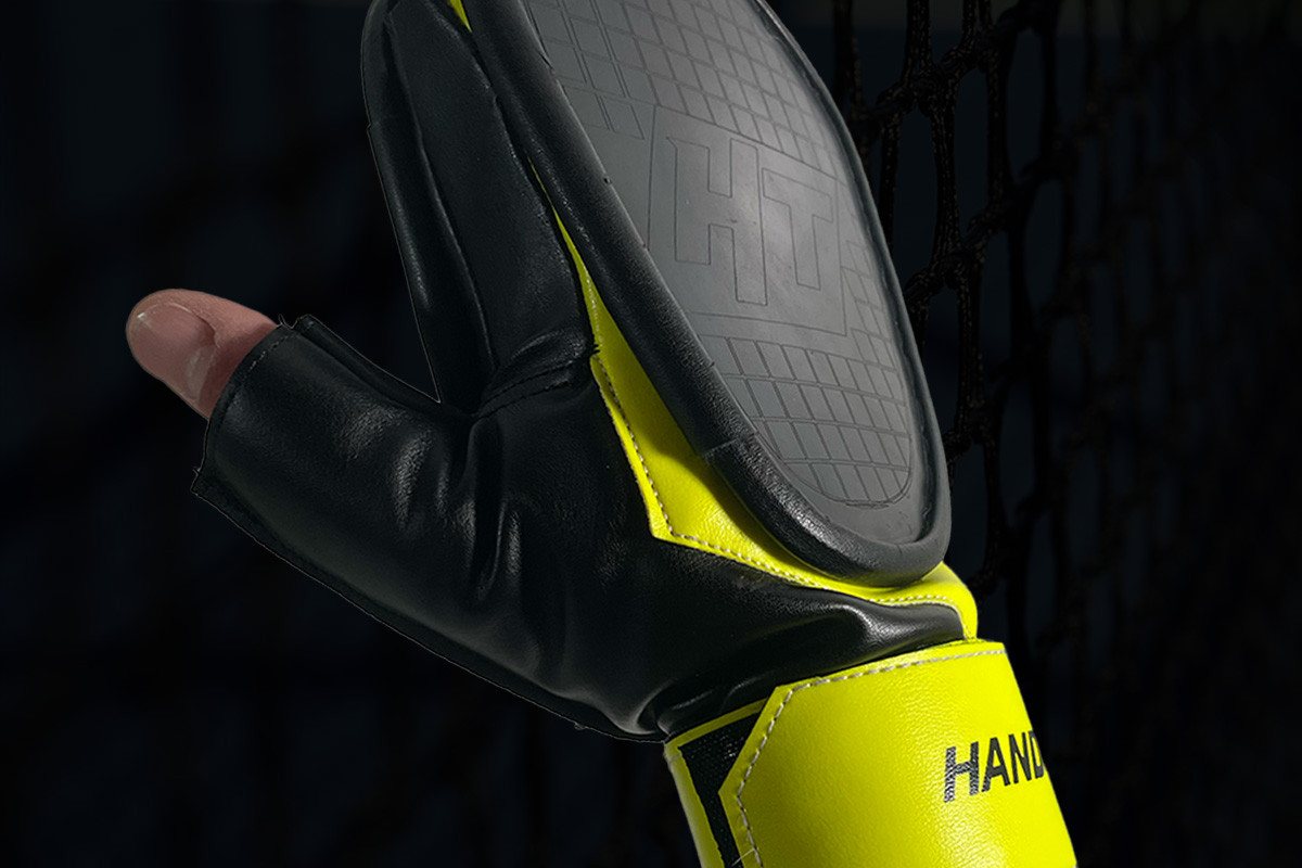 Production Hand Tennis glove worn on the hand, showing the textured striking face